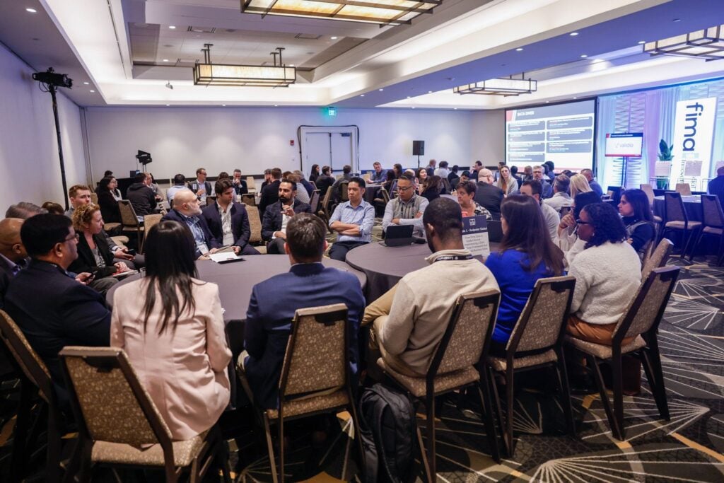 Conference attendees participating in roundtable discussions at FIMA US