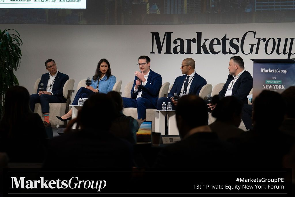 Experts sharing insights at a panel discussion at the Private Equity Forum
