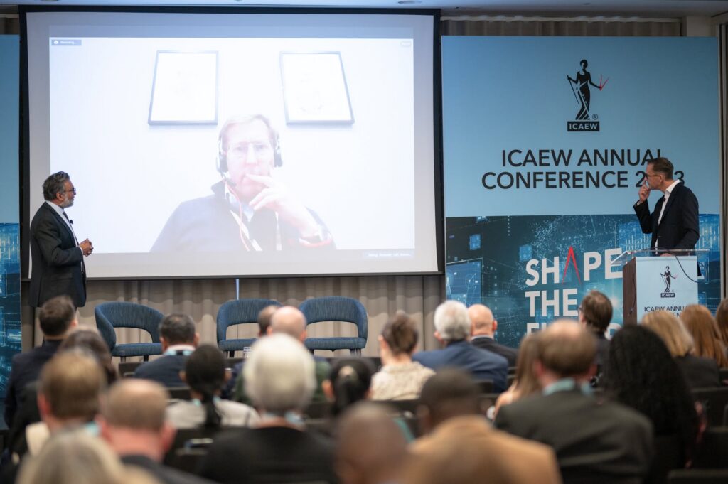 Speakers presenting to an audience during a session at the ICAEW Annual Conference