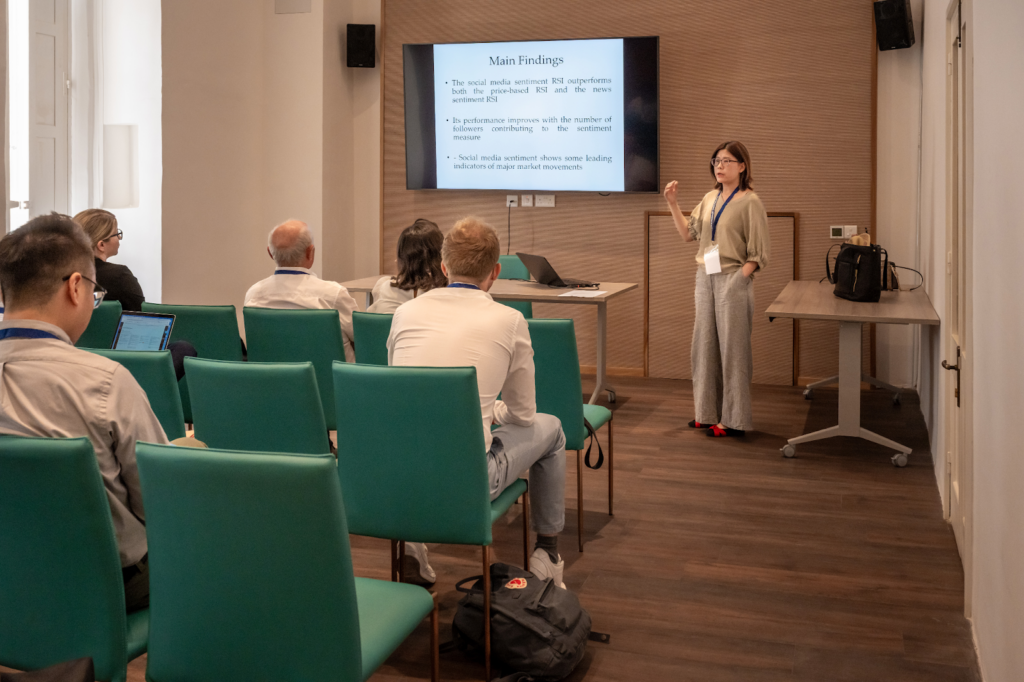 A speaker presenting research findings at the World Finance Conference